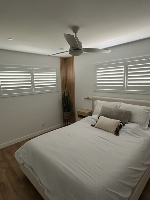 Bedroom with new custom plantation shutters with hidden tilt.